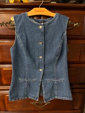 FORE Women’s Longline Denim Vest in a flattering fitted silhouette.